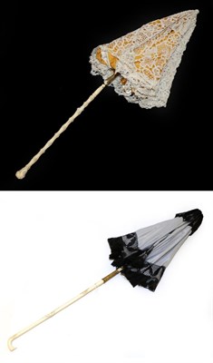 Lot 4119 - A Pretty 19th Century Folding Parasol with tape lace cover, relined recently, the lower shaft...