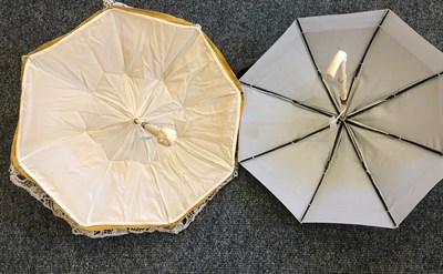 Lot 4119 - A Pretty 19th Century Folding Parasol with tape lace cover, relined recently, the lower shaft...