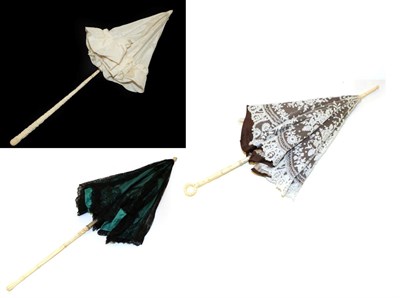 Lot 4121 - A 19th Century Brussels Bobbin Lace Parasol, the lower shaft of carved bone finishing in a...