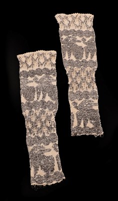 Lot 4127 - A Pair of Ornately Beaded Knitted Fingerless Mittens, the silver metal beads worked on the cuffs to