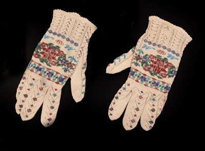 Lot 4129 - A Pair of 19th Century Cream Gloves, knitted with various designs and embellished with beads....