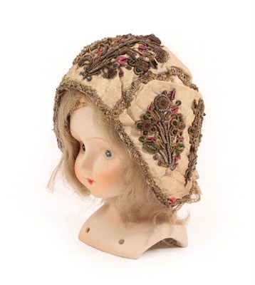 Lot 4133 - An 18th Century European Child's Cap worked in gold threads, and silver coiled thread, edged...