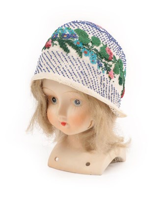 Lot 4137 - A Circa 1820's Knitted Silk Beaded Child's or Doll's Cap or Bonnet edged with blonde lace, a...