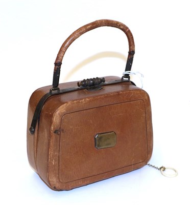 Lot 4155 - A Mid-19th Century Sewing Companion of handbag form, in tan leather, with metal frame. The...