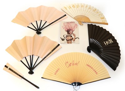 Lot 4162 - A Perfumed Fan, black feathers mounted on black plastic, the upper guard with a gold embossed label