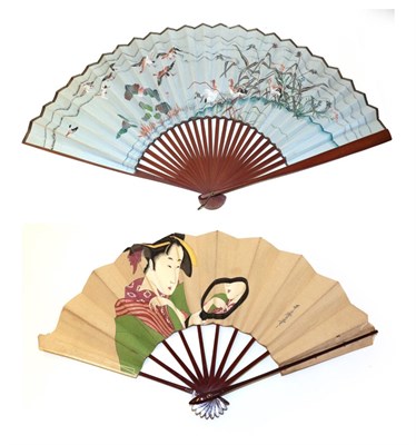Lot 4209 - Two Japanese Paper Fans mounted on varnished wood, comprising a signed and dated depiction of a...