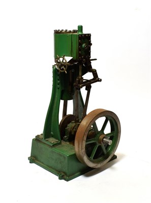 Lot 5244 - Stationary Upright Engine with single cylinder and flywheel on heavy cast base, with indistinct...