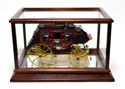 Lot 5365 - Franklin Mint Wells Fargo Stage Coach in display case with mirrored base (E)