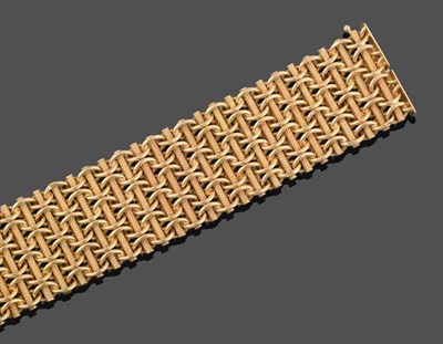 Lot 2049 - An 18 Carat Gold Fancy Link Bracelet, yellow textured tubes linked by entwined plain polished...