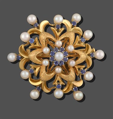 Lot 2084 - A Cultured Pearl and Synthetic Sapphire Brooch, of domed form, a double yellow textured floral...