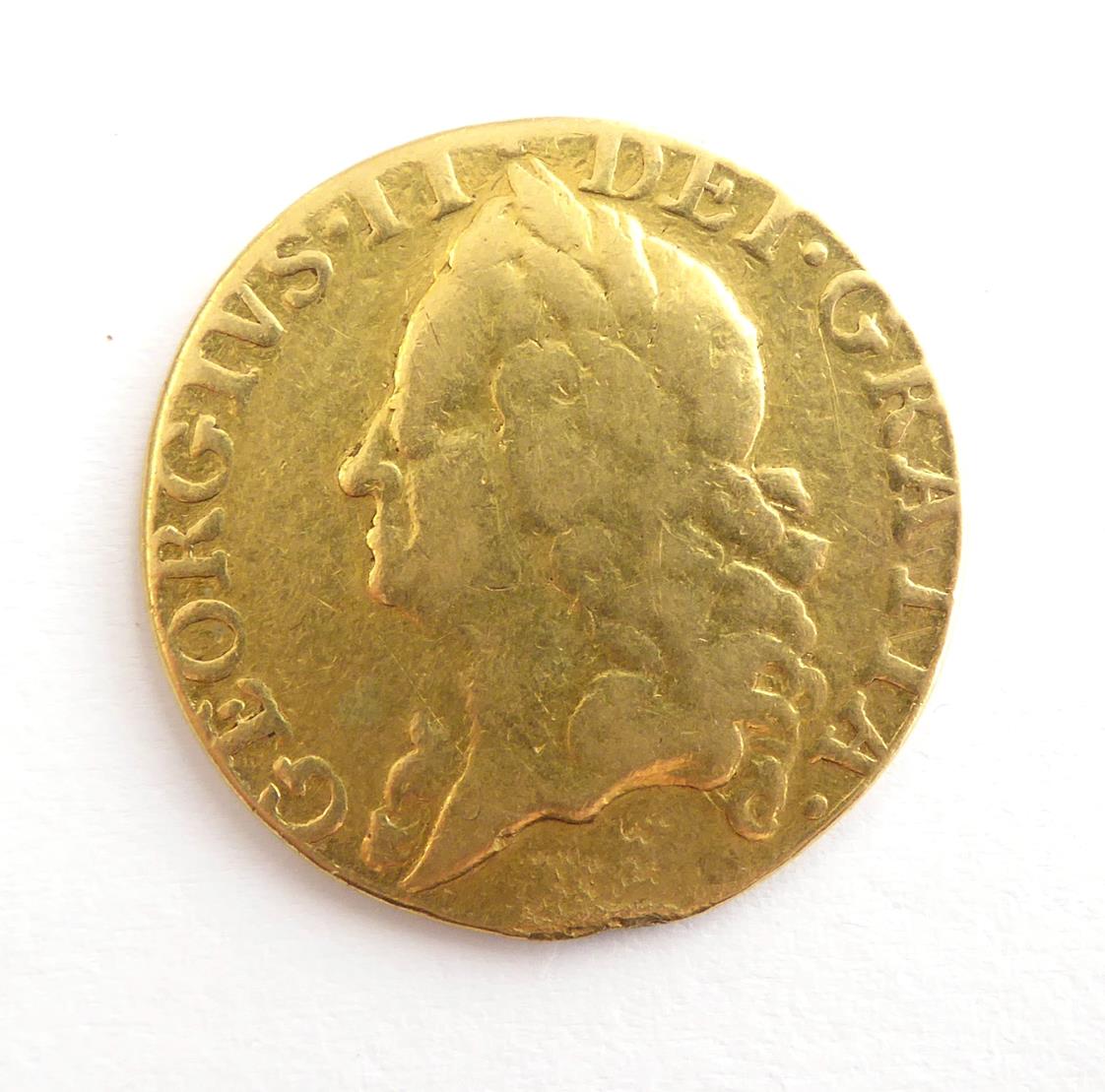 Lot 2054 - George II Guinea 1748 Old Laur. Head S3680 VG probably a contemporary copy ex mount 12 o'clock