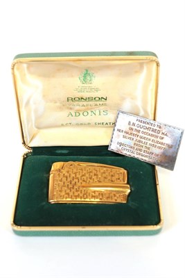 Lot 60 - An Elizabeth II Gold Sheathed Cigarette-Lighter, by Ronson, 9ct, with textured finish, in...