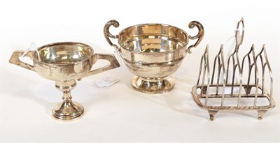 Lot 71 - An Edward VII Silver Toast-Rack and Two Cups, The Toastrack by William Hutton and Sons,...