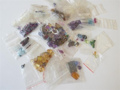 Lot 103 - A Quantity of Loose Gemstones, including garnets, rubies, sapphires, peridot, paste, synthetic...