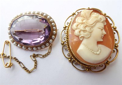 Lot 128 - A Cameo Brooch, in a scroll frame stamped '9CT', measures 3.2cm by 3.8cm; and An Amethyst and...