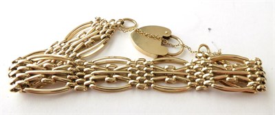 Lot 146 - A 9 Carat Gold Fancy Link Bracelet, with 9 carat gold padlock clasp, length 20cm