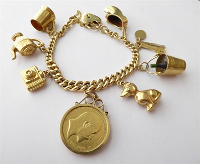 Lot 149 - A Charm Bracelet, stamped '9' and '.375', hung with various charms including a 1903 sovereign,...