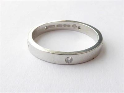 Lot 153 - A Platinum Diamond Set Band Ring, finger size O