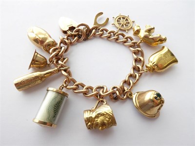 Lot 155 - A Charm Bracelet, stamped '9C', hung with ten charms including an owl, a helmet, a wishbone...