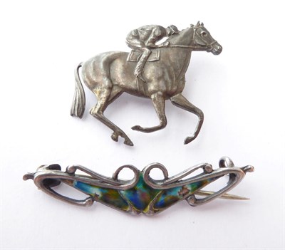 Lot 160 - An Arts & Crafts Enamel Silver Brooch; and A Horse and Jockey Brooch, stamped 'STERLING SILVER' (2)
