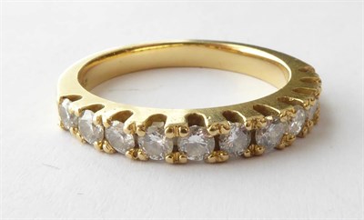 Lot 163 - An 18 Carat Gold Diamond Half Hoop Ring, finger size O