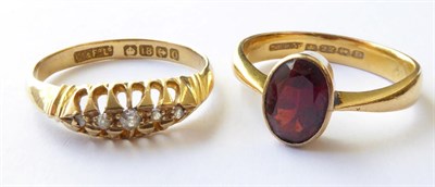 Lot 168 - A 22 Carat Gold Garnet Ring, finger size N1/2; and An 18 Carat Gold Diamond Five Stone Ring, finger