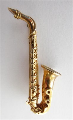 Lot 190 - A 9 Carat Gold Brooch, in the form of a saxophone, length 4.7cm