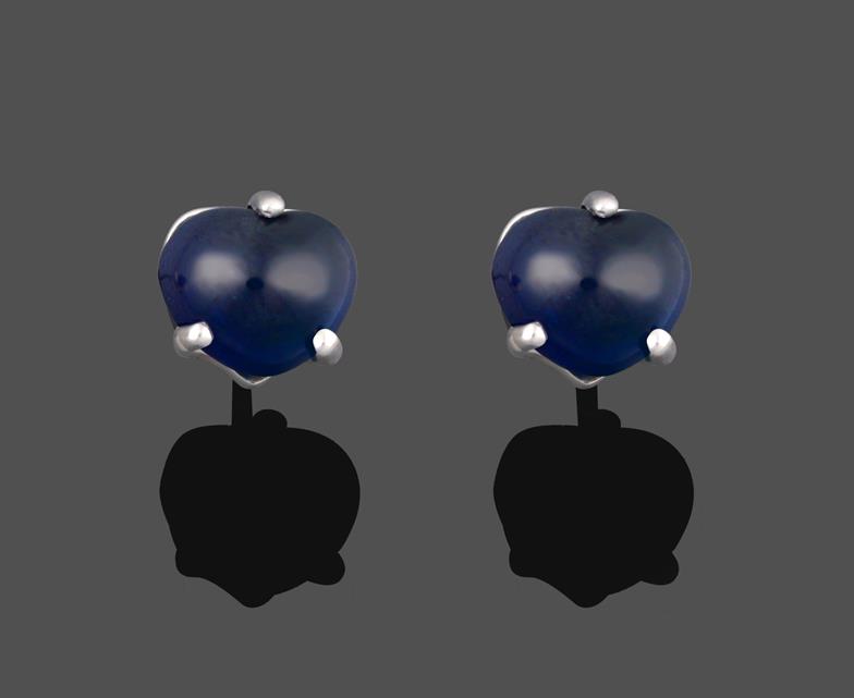 Lot 2000 - A Pair of Sapphire Earrings, the heart shaped cabochon sapphires in a white three claw setting,...