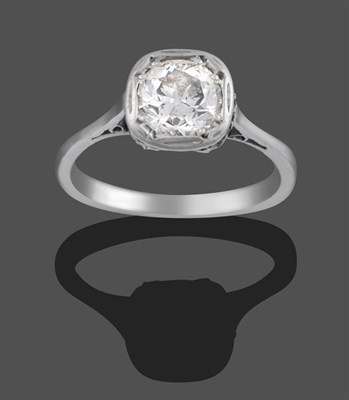 Lot 2023 - A Diamond Solitaire Ring, the old cut diamond in a white claw and rubbed over setting, to a tapered