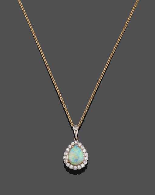 Lot 2025 - An 18 Carat Gold Opal and Diamond Cluster Pendant on Chain, the pear cut cabochon opal in a...
