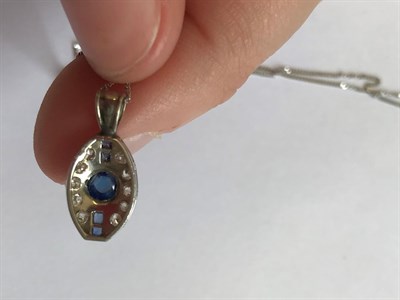 Lot 2036 - An Art Deco Sapphire and Diamond Pendant on Chain, the round cabochon sapphire flanked by pairs...