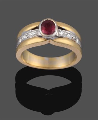 Lot 2040 - An 18 Carat Two Colour Gold Ruby and Diamond Ring, the oval cut ruby in a white rubbed over...