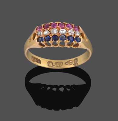 Lot 2042 - An 18 Carat Gold Ruby, Sapphire and Diamond Ring, rows of round cut rubies, rose cut diamonds...