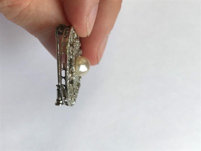 Lot 2044 - An Edwardian Diamond and Pearl Brooch, the pearl within an old cut and rose cut diamond set...