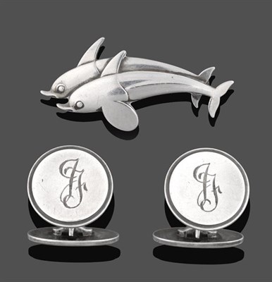 Lot 2057 - A Brooch, by Georg Jensen, depicting two stylised diving dolphins, numbered 317, length 4.1cm;...