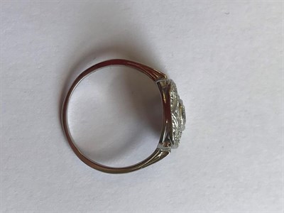 Lot 2069 - An Art Deco Style Diamond Ring, a round brilliant cut diamond within a diamond set pierced...