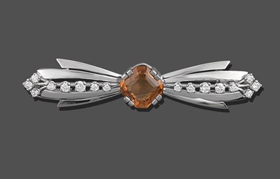 Lot 2101 - A Citrine and Diamond Brooch, realistically modelled as a bow, the central emerald-cut citrine in a