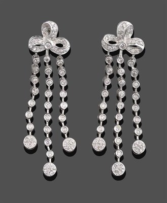 Lot 2113 - A Pair of Diamond Drop Earrings, a bow motif set throughout with round brilliant cut diamonds...