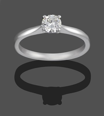 Lot 2116 - A Platinum Diamond Solitaire Ring, the round brilliant cut diamond in a claw setting, to a...
