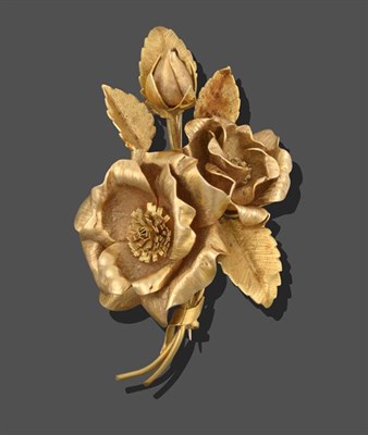 Lot 2128 - An 18 Carat Gold Floral Brooch, realistically modelled as three rose heads, measures 6.5cm by 3.9cm