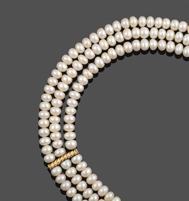 Lot 2129 - A Triple Row Cultured Pearl Necklace, the 94:99:104 cultured pearls knotted to a yellow...