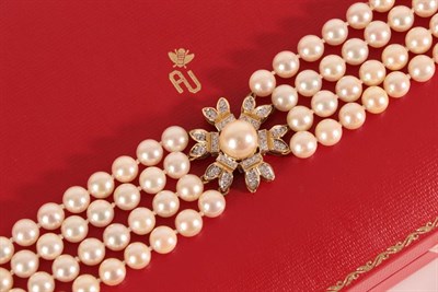 Lot 2131 - An 18 Carat Gold Four Row Cultured Pearl Choker, the 44:44:44:47 cultured pearls knotted with a...
