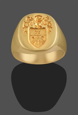 Lot 2136 - A Signet Ring, the yellow engraved seal depicting a bee above a chevron, flanked by two sun...
