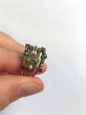Lot 2142 - A Multi-Gemstone Stacking Ring, formed of five bands each set with alternating round cut...