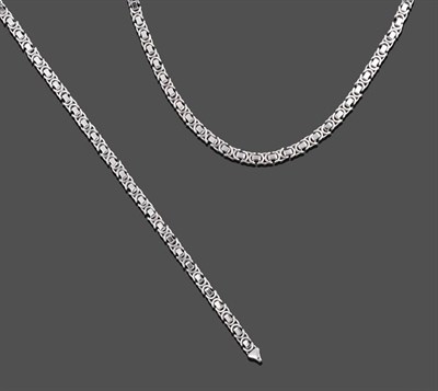 Lot 2145 - A 9 Carat White Gold Fancy Link Necklace and Bracelet, en suite, rectangular links spaced by...