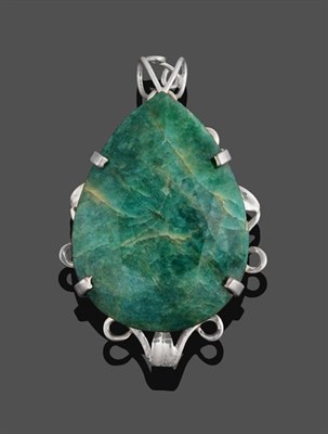 Lot 2149 - An Emerald Pendant, the pear cut emerald in a white claw setting to a scroll border, measures 7.6cm