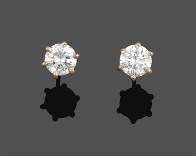 Lot 2152 - A Pair of 18 Carat White Gold Diamond Solitaire Earrings, the round brilliant cut diamonds in...