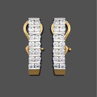 Lot 2158 - A Pair of Diamond Earrings, seven pairs of round brilliant cut diamonds spaced by fixed white bars