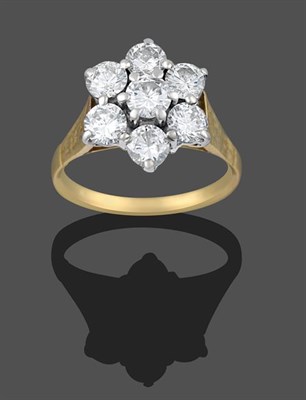 Lot 2162 - A Diamond Cluster Ring, seven round brilliant cut diamonds in yellow claw settings, to a...