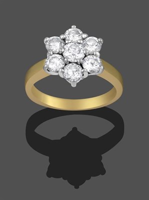 Lot 2164 - An 18 Carat Gold Diamond Cluster Ring, seven round brilliant cut diamonds in white claw...